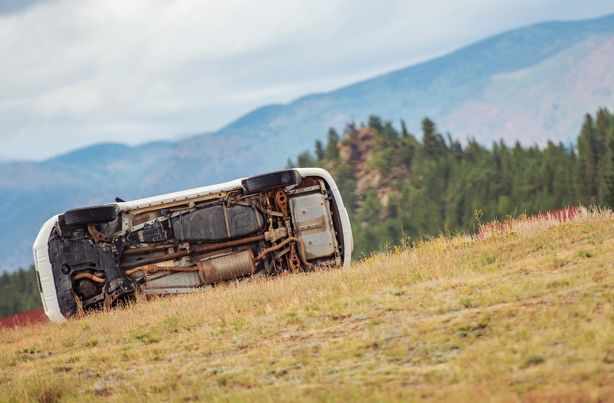 A car flipped on its side.