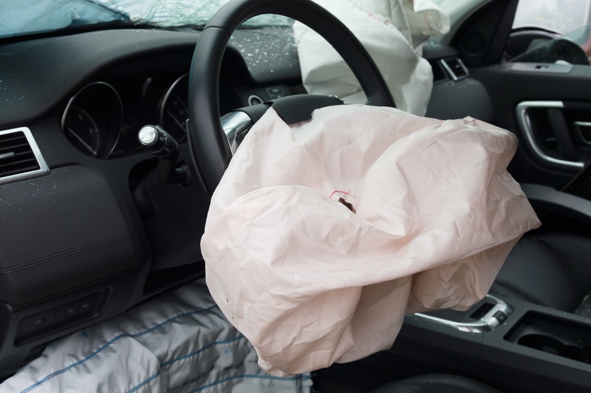 The inside of a vehicle with the airbags deployed following a crash.