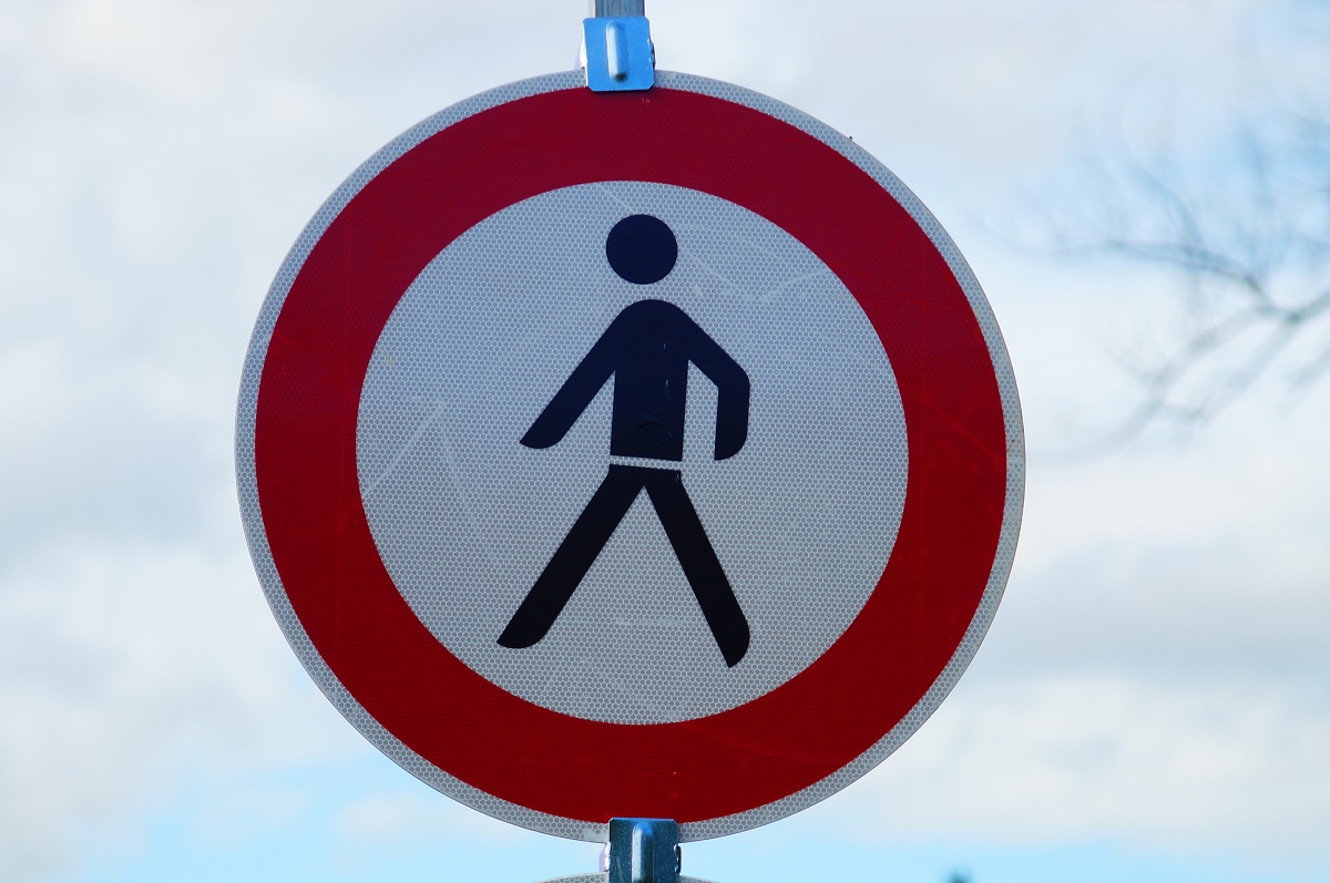 A pedestrian crossing sign.