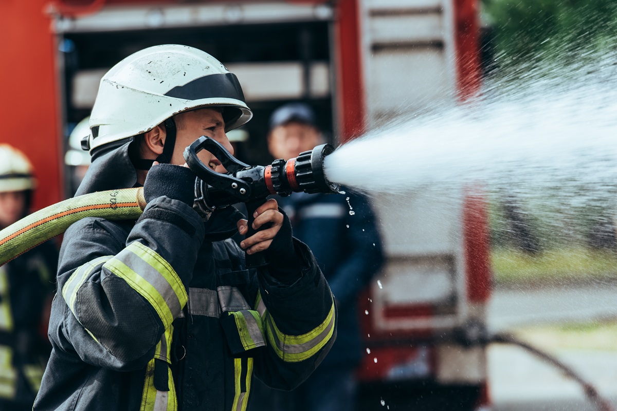 Firefighters using a fire hose
